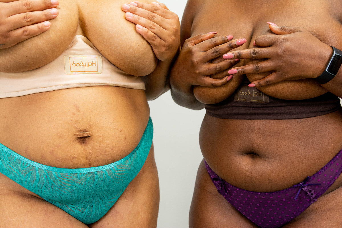 Two models wear the cotton body pH bra liners without a bra
